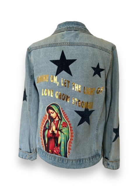 'Shine on' blue denim jacket with stars and Our Lady detail.